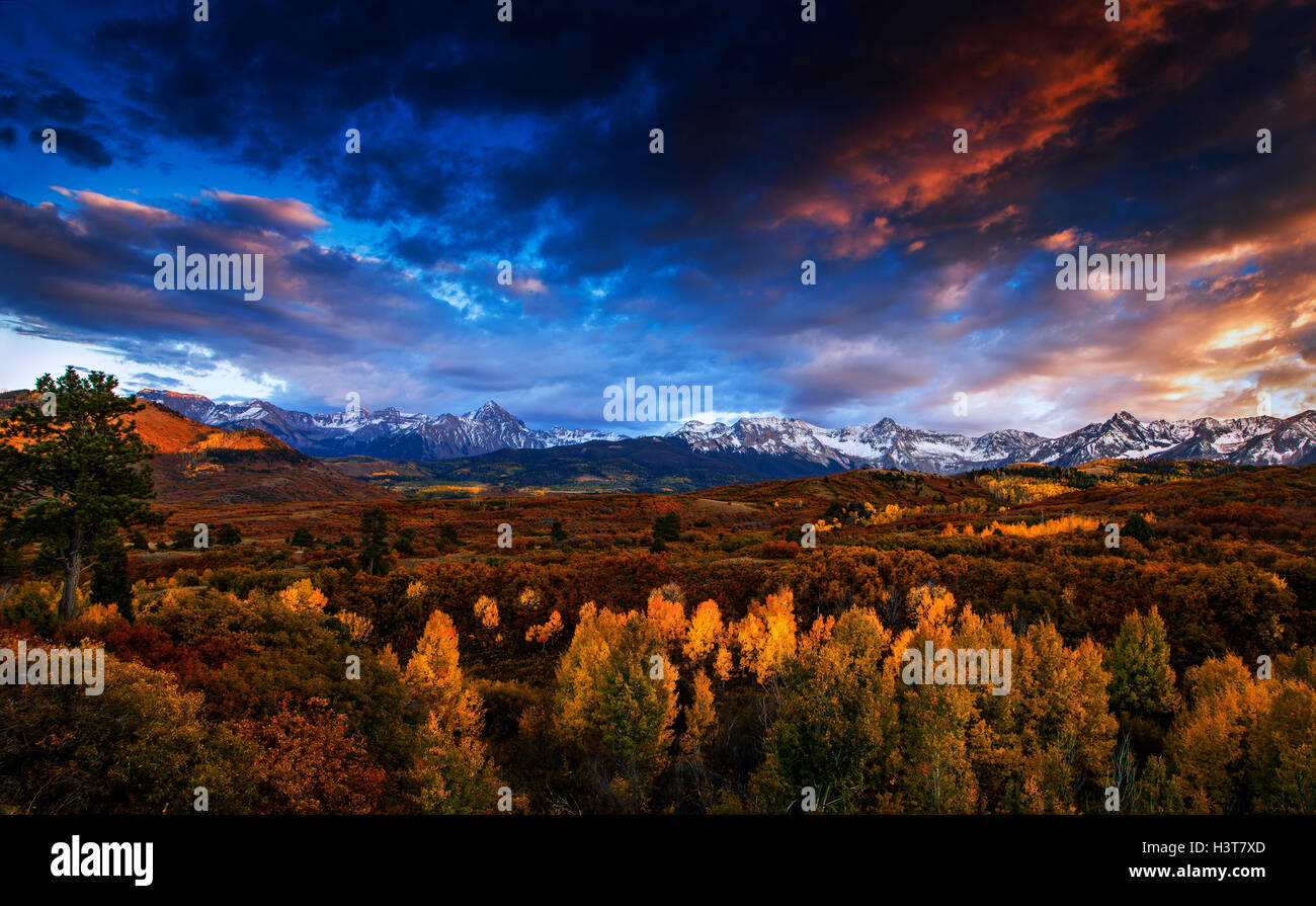 Autumn panorama at sunset of Colorado's San Juan Mountains seen from the 8,900 foot high pass at the Dallas Divide. Stock Photo