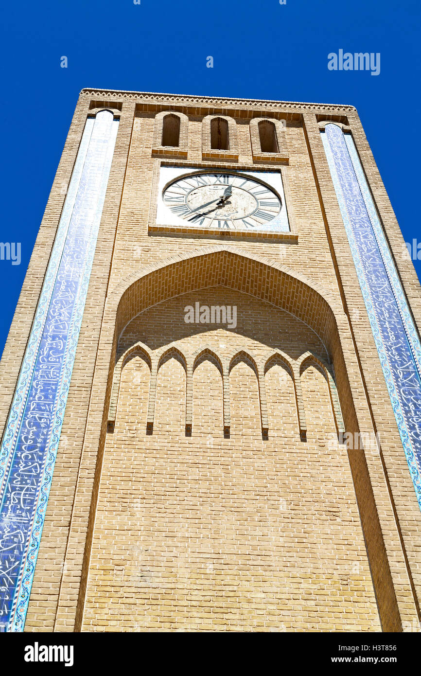 in iran old yazd city and the antique brick clock tower near the sky
