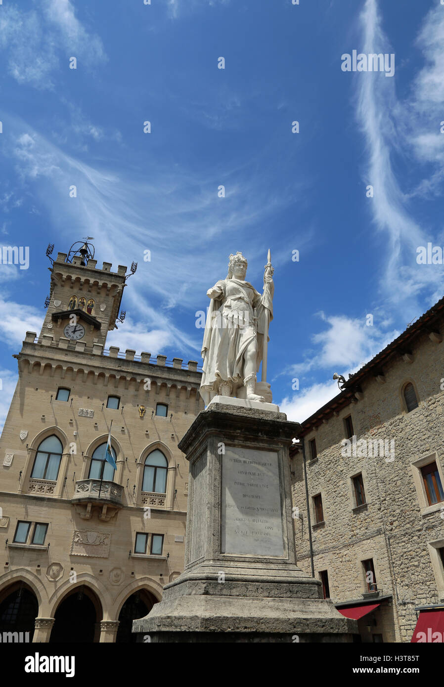 Statue of Liberty in San Marino Country and the ancient palace called Palazzo Pubblico seat of Government in Central Italy and b Stock Photo