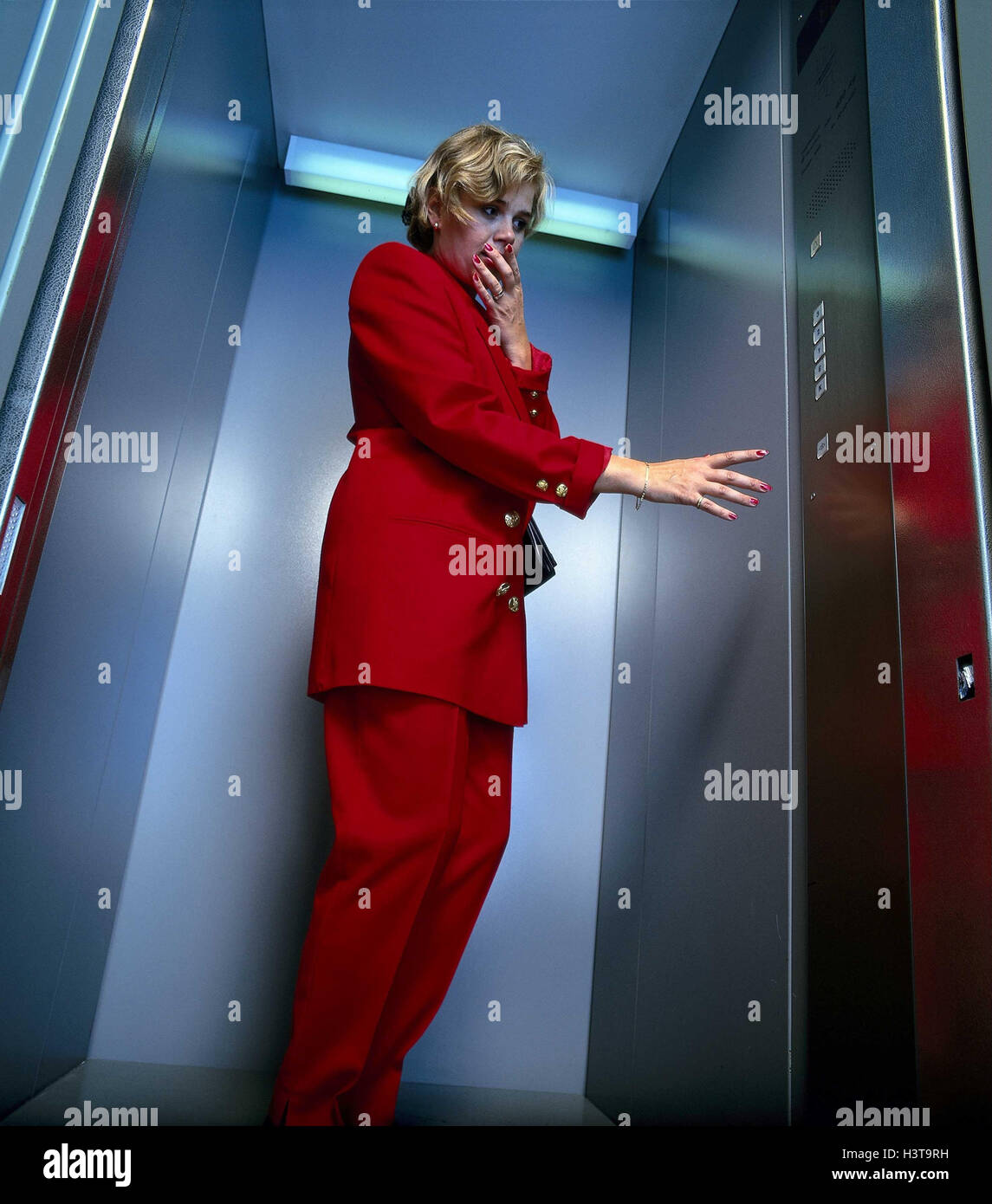 Claustrophobia, lift, woman, fear lift, fear, oppression, agoraphobia,  panic, phobia, states anxiety, emergency situation, restrains, narrowness,  need, predicament, helplessly, desperately, desperation, agoraphobia  helplessness, inside Stock Photo - Alamy