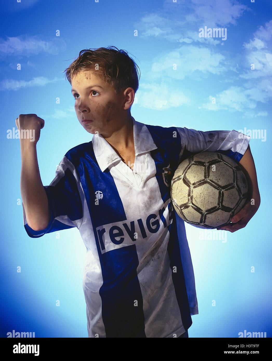 Boy, football players, gesture, successfully, half portrait, child, football, hold, sport, sportsman, sportily, ball game, success, ambition, ambitiously, victory, winner, winner, cut out, leisure time, leisure activity, hobby Stock Photo
