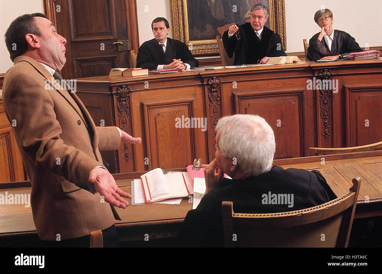 Dish scene, defendant, gesture, innocence judicature, dish, courtroom, negotiations, charge, hearing, right, justice, judges, assessors, sollicitor, defendant, statement, witness's statement, innocence, innocent, innocently, ignorantly, helplessly, unsusp Stock Photo