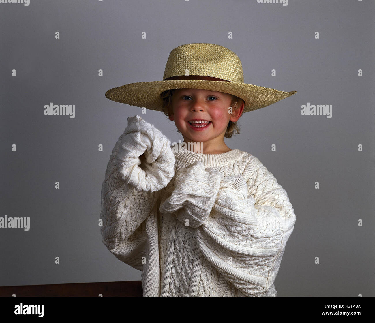 Girls, straw hat, wool pullover, outsize, smile, half portrait, studio child, clothes, oversized, adult's clothes, pullover, knitted pullover, care, game, fun, childhood, carefree nature, Stock Photo