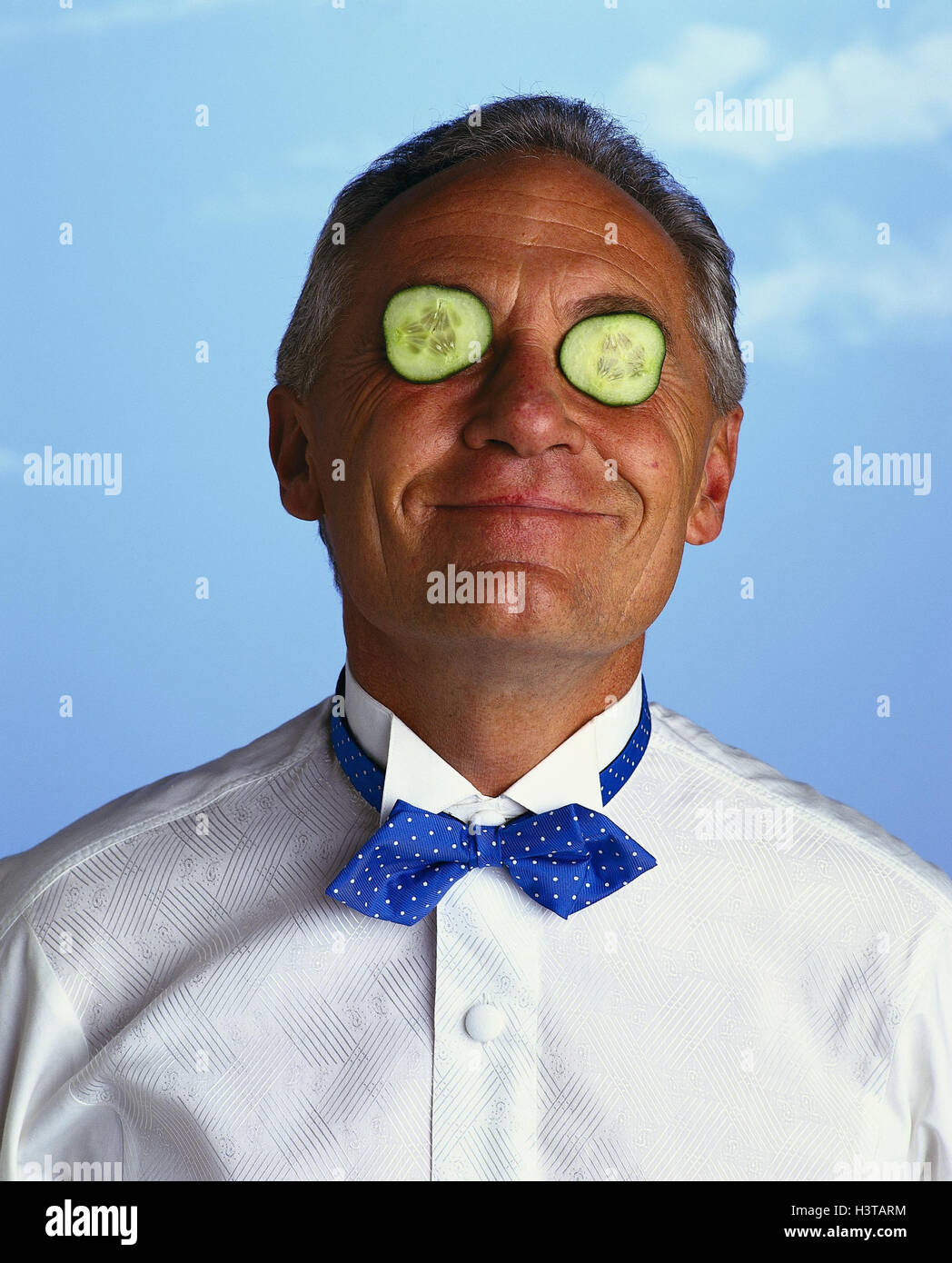 Man, eyes, cucumber slices, smile, portrait, grin inside, middle old person, cucumber, cucumber slice, happy, studio, cut out, stupidly, nonsense, humor, gag, cheerfulness, joke, funnily, joke, fun, amusement Stock Photo