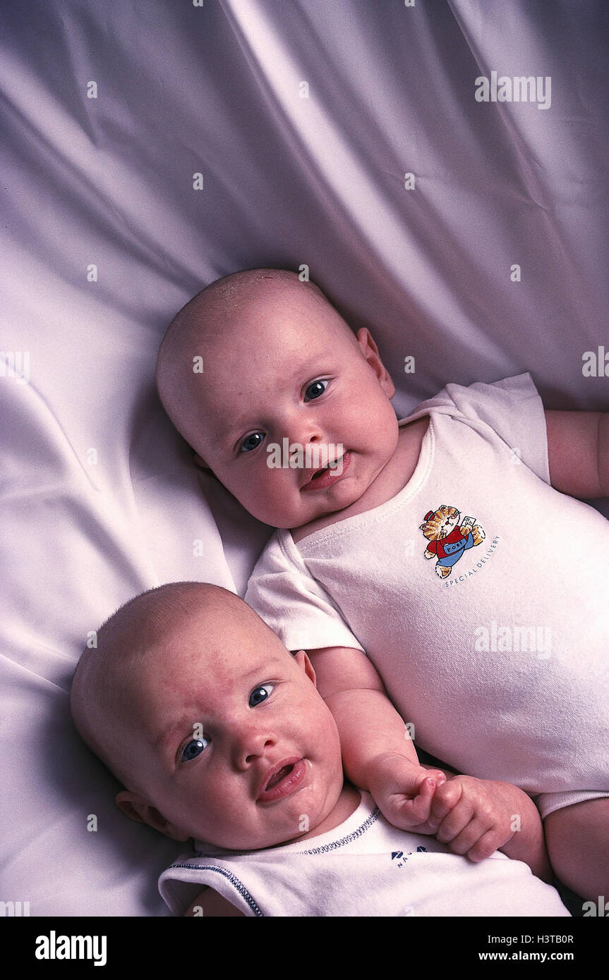 Infants, twins inside, children, babies, babies, two, siblings, identically, lie, side by side, carefully, attention Stock Photo