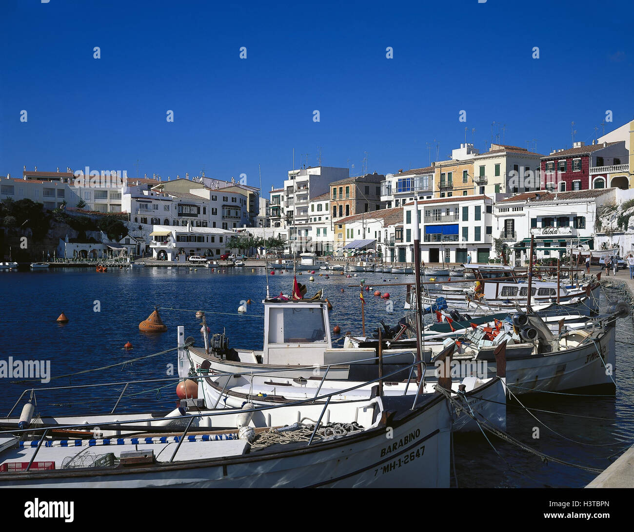 Spain, the Balearic Islands island, Menorca, It Castell, Cales Fonts, harbour, local view AUTHOR'S NAMING OBLIGATORILY, the Balearic Islands, island, the Mediterranean Sea, sea, place, harbour bay, ships, boots, residential houses, promenade Stock Photo