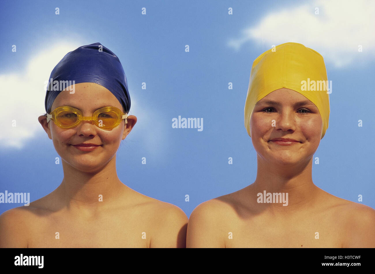 Girls, bathing caps, grin, portrait, outside, summer, children, two, friends, 8 years, 10-15 years, swimwear, swimming glasses, happy, free upper part of the Body, leisure time, childhood, happy, funnily, amuses, expression, studio, outdoor swimming pool, Stock Photo
