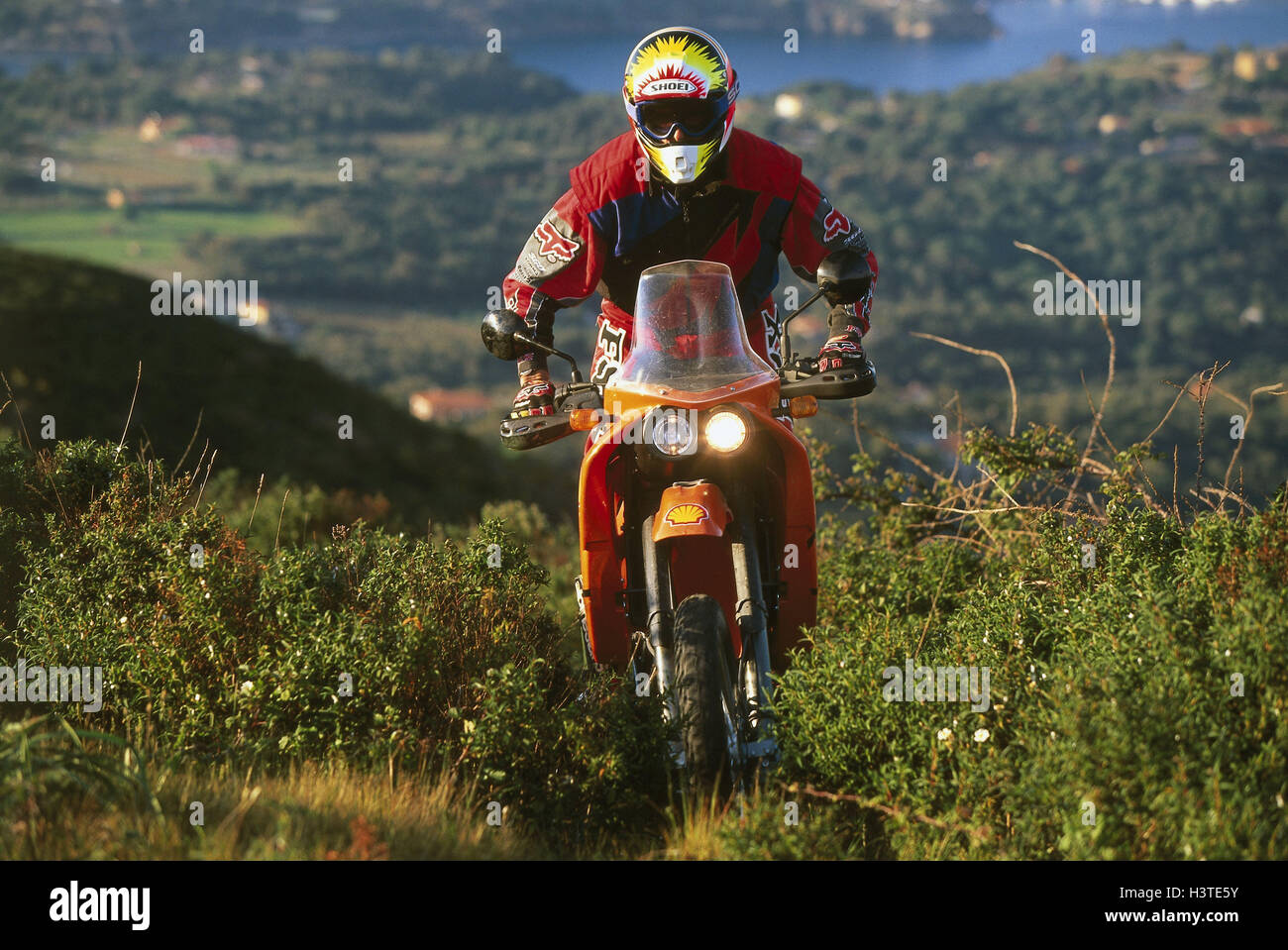 Moto cross driver, coastal scenery Stock Photo