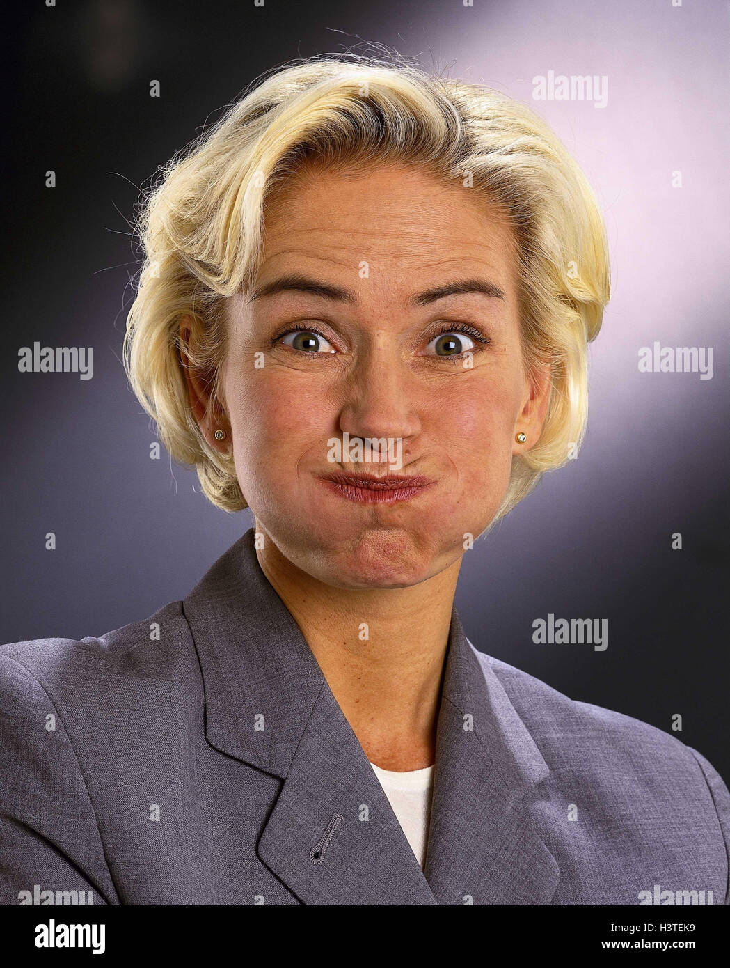 Woman, young, blond, facial play, chubby cheeks, portrait, women, studio, businesswoman, snort, finish laughing, mock, mockery, cut out, view, camera, air, stop, to aerial clues, Stock Photo