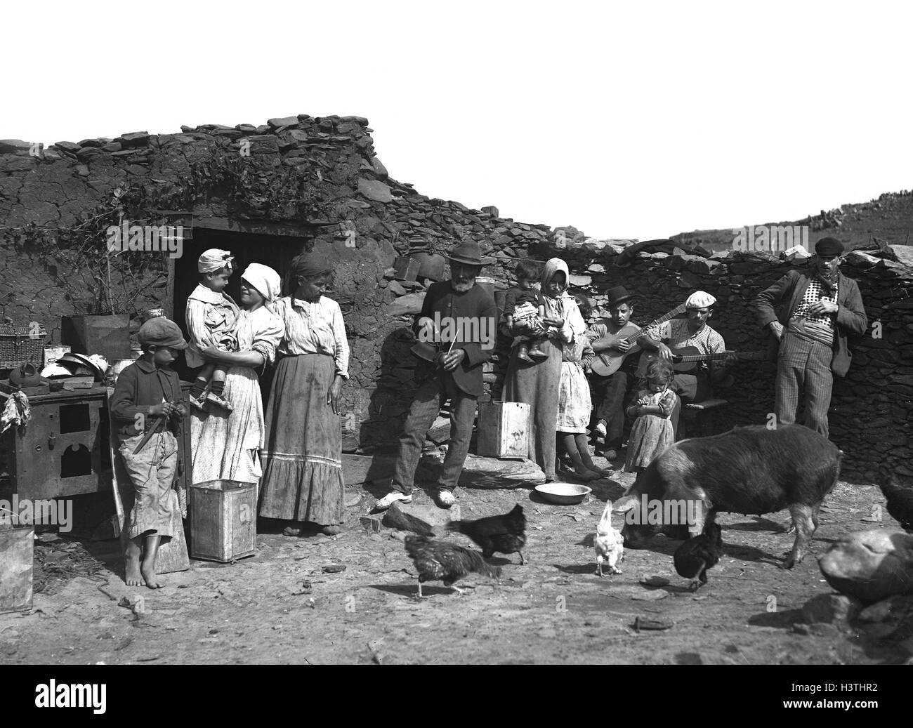 Spanish peasant farming family gathering with their animals 1910 Stock Photo