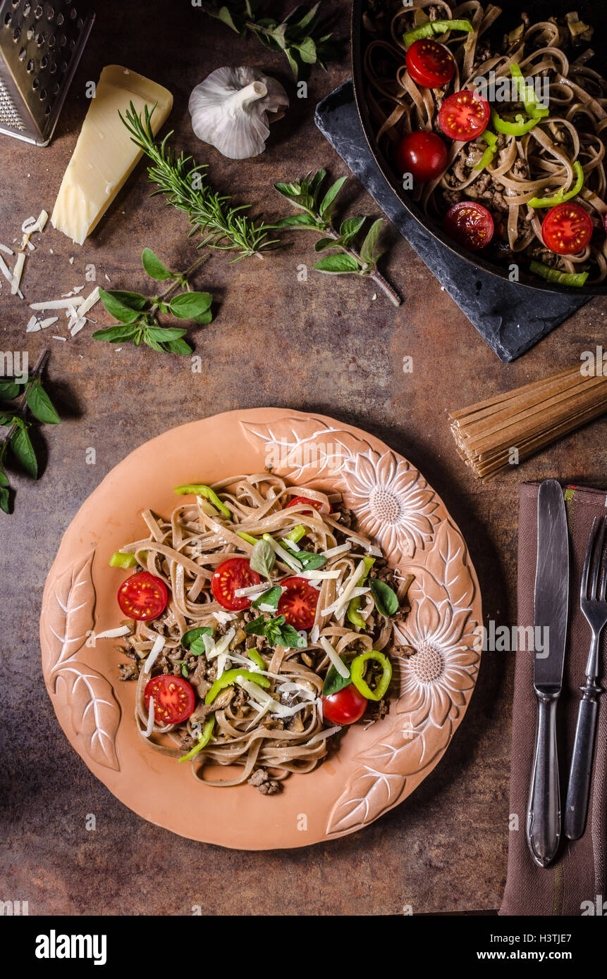 Whole grain pasta with cheese parmesan and tomatos Stock Photo Alamy