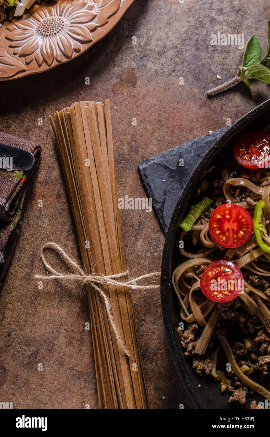 Whole grain pasta with cheese parmesan and tomatos Stock Photo Alamy