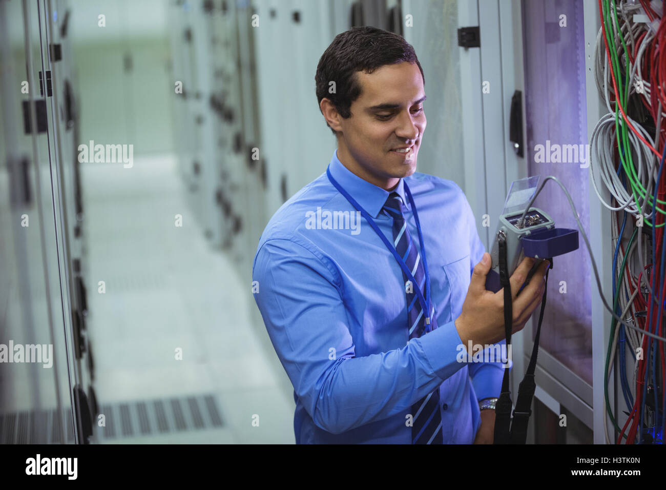 Technician using digital cable analyzer Stock Photo - Alamy