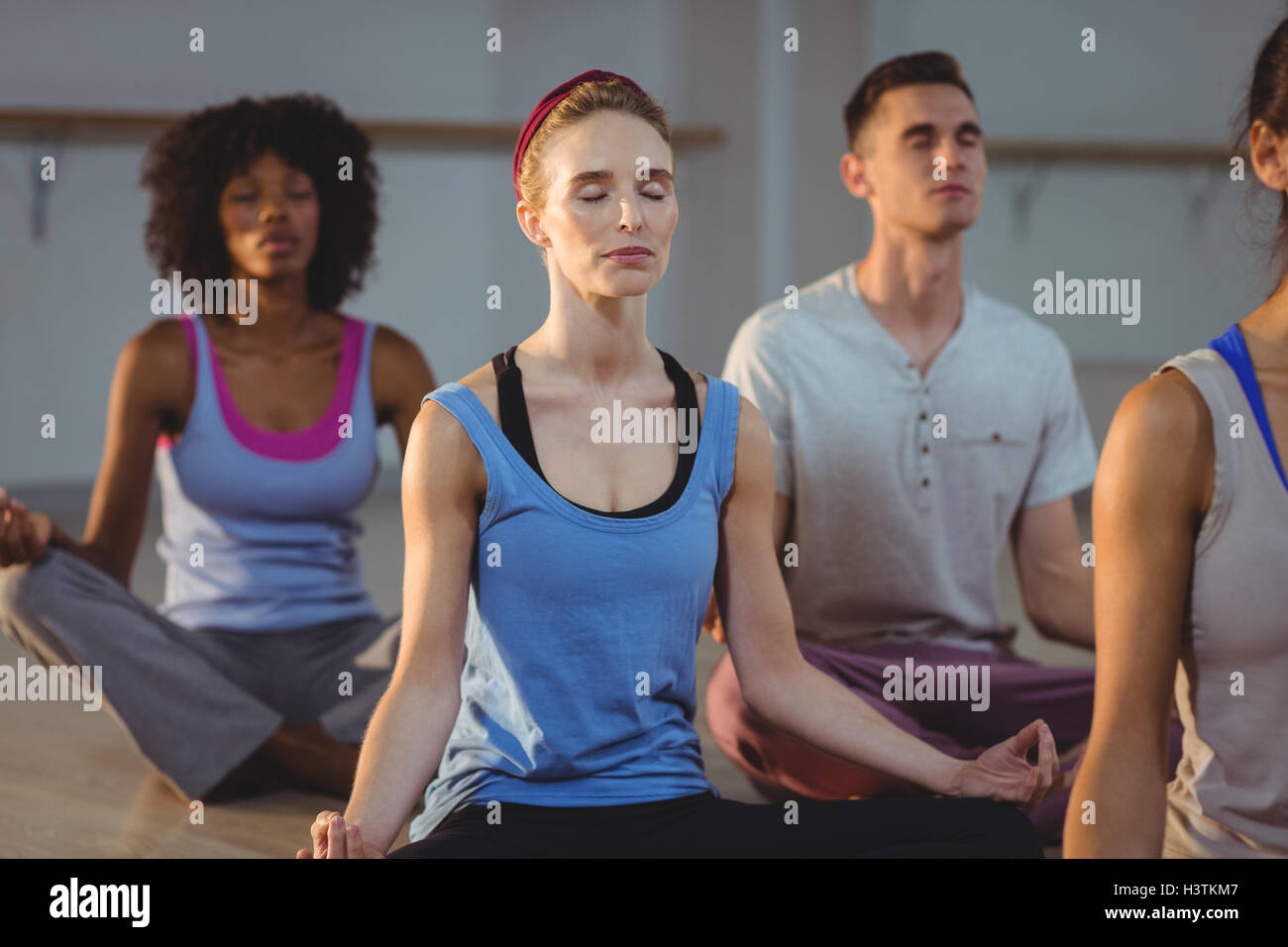 Group of people performing yoga Stock Photo - Alamy