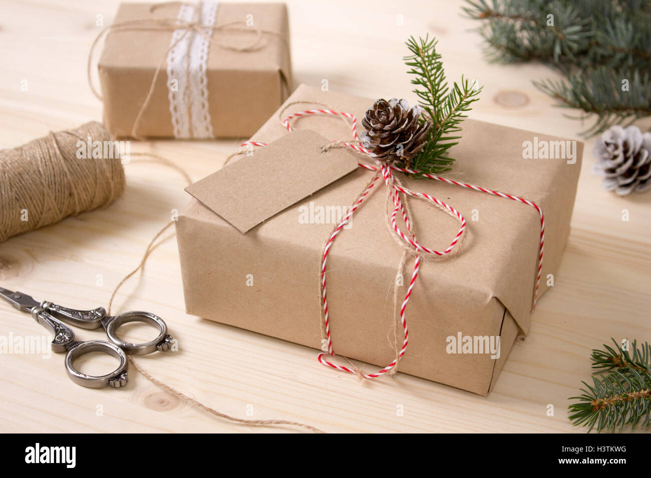 Christmas Gift Box with Tag, Mock-up. Craft Items Set. Wooden Background. Stock Photo