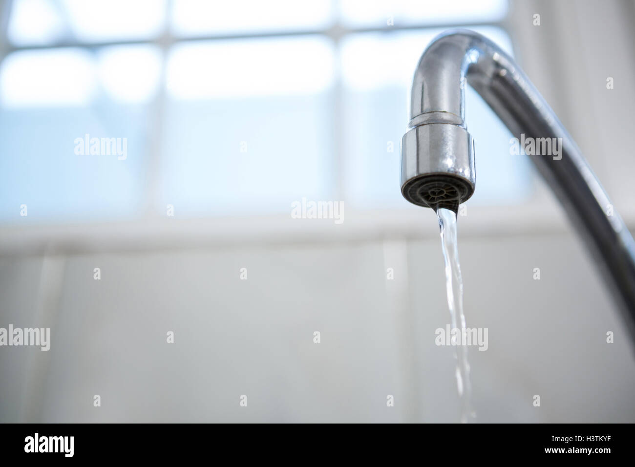 Close-up of water flowing from a tap Stock Photo - Alamy