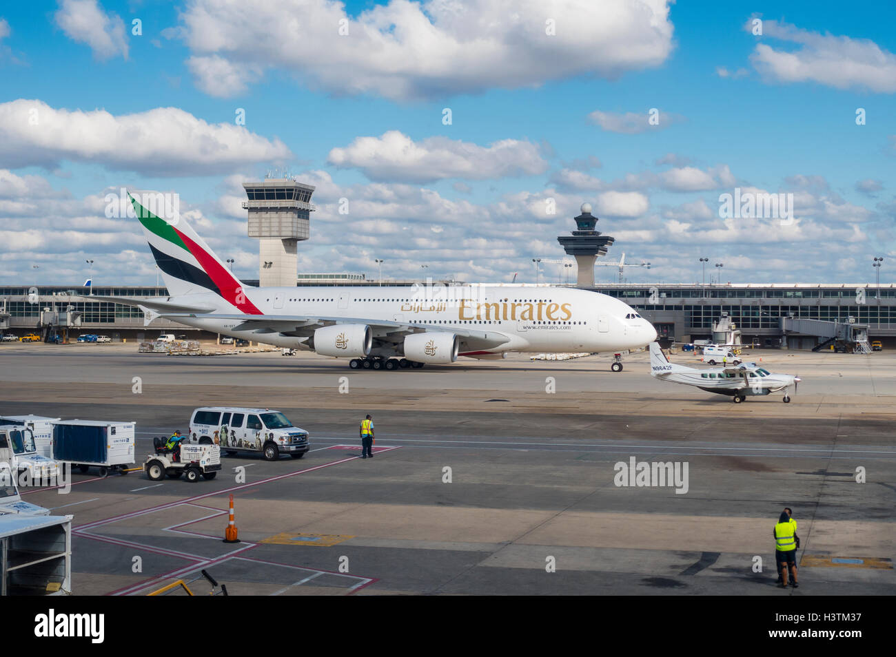 DULLES INTERNATIONAL AIRPORT, VIRGINIA, USA - Emirates Airline Airbus A380-800 commercial passenger jet airliner taxis. Stock Photo