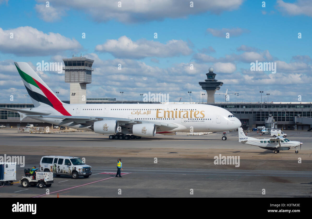 DULLES INTERNATIONAL AIRPORT, VIRGINIA, USA - Emirates Airline Airbus A380-800 commercial passenger jet airliner taxis. Stock Photo