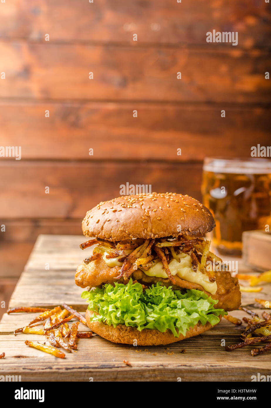 Fish and Chips Burger with fried potato straw and grilled portobello