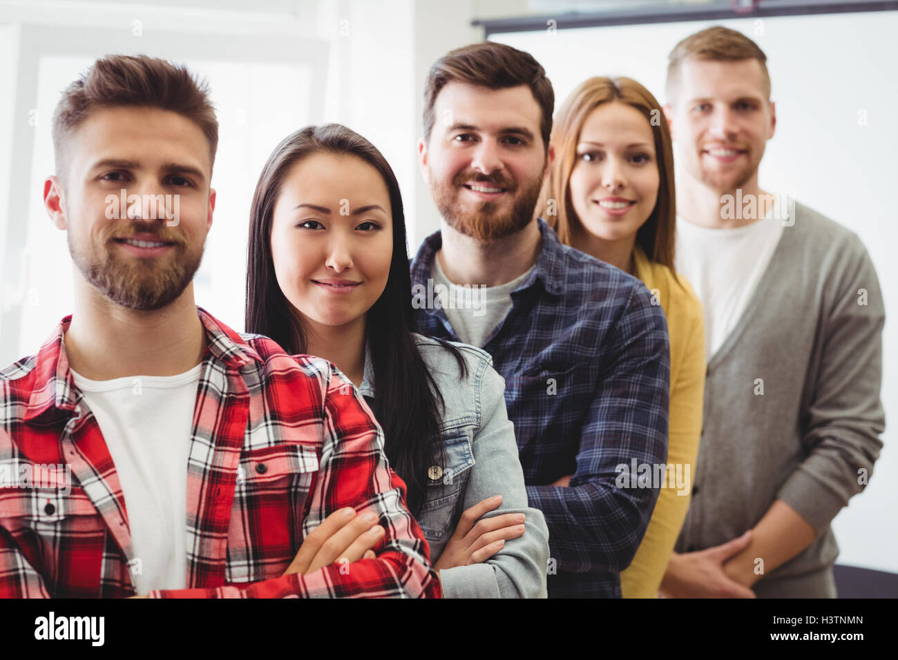 Creative business people standing in row Stock Photo - Alamy