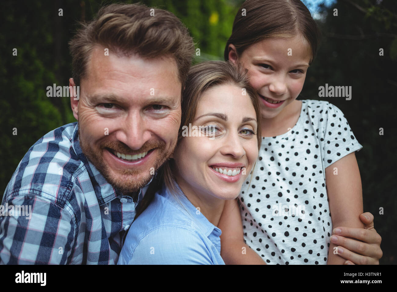 Portrait happy family in sunlight hi-res stock photography and images ...