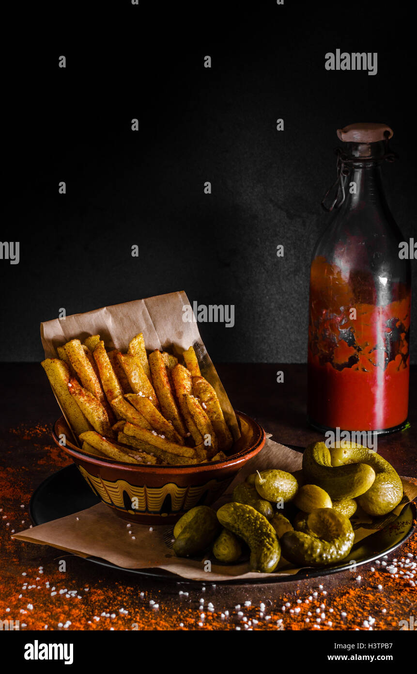 French fries and homemade ketchup, pickles, all homemade Stock Photo Alamy