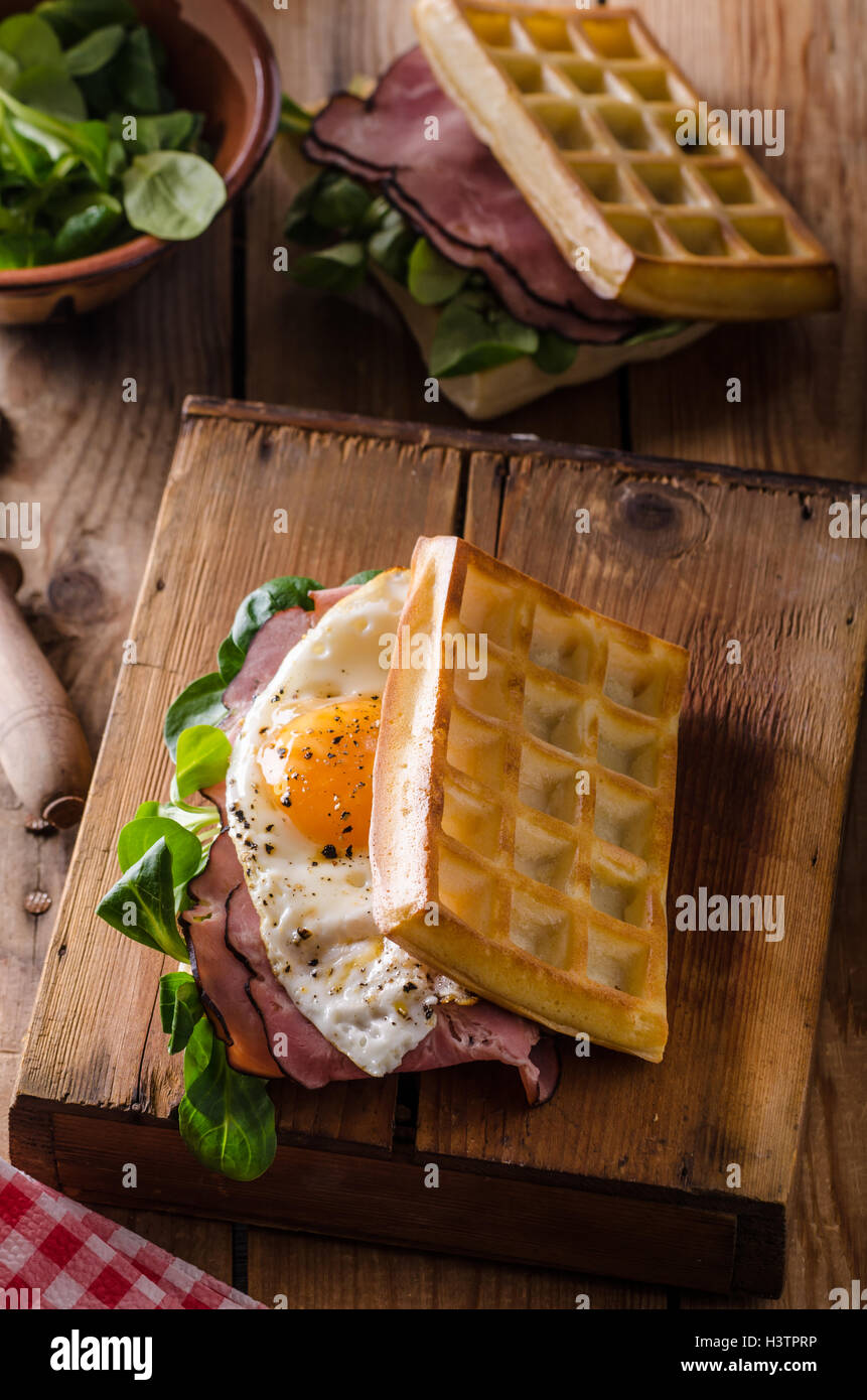 Waffles sandwich with eggs and lettuce, old style sandwich Stock Photo