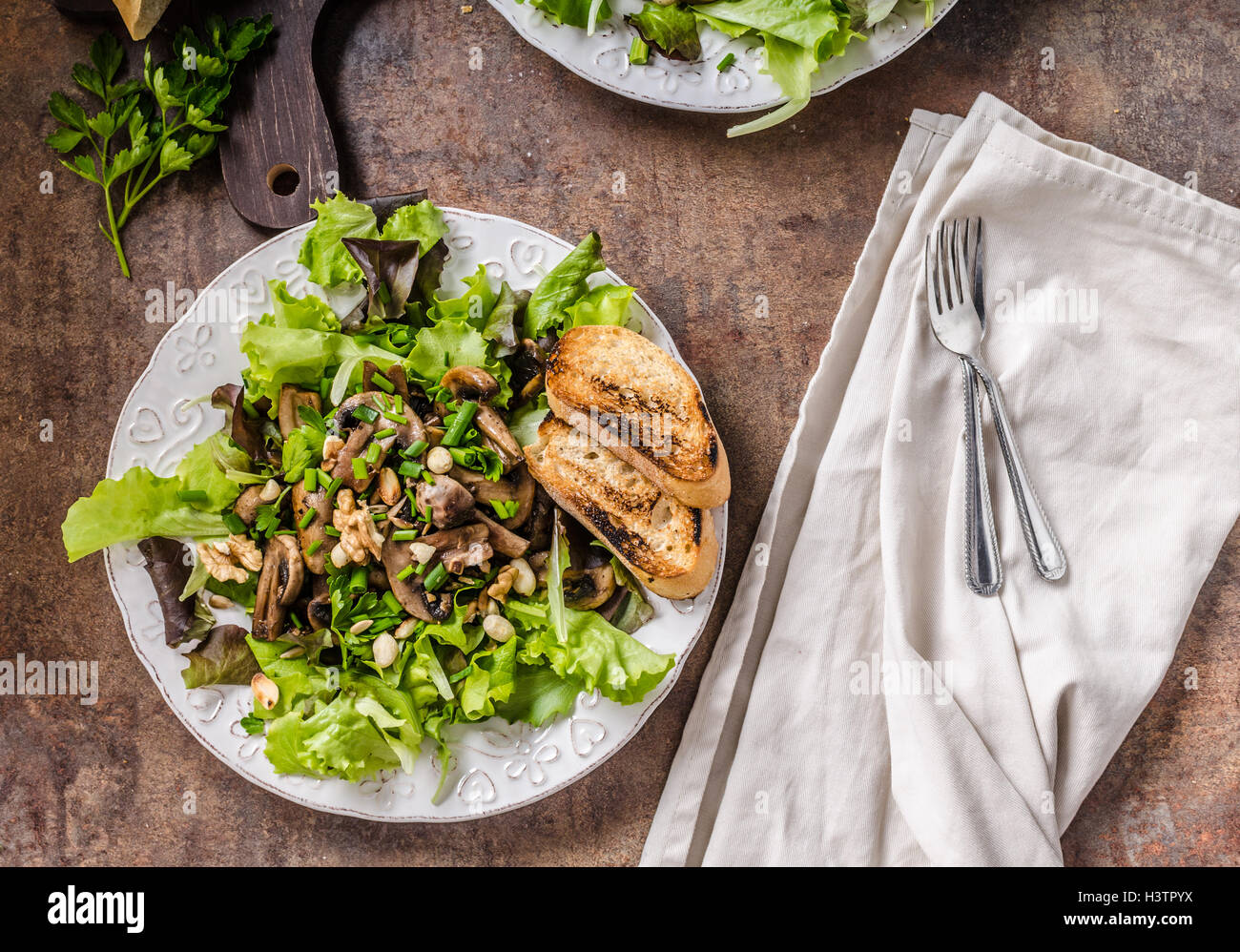 Mushroom salad with walnuts with baguette, lots of herbs inside, realy
