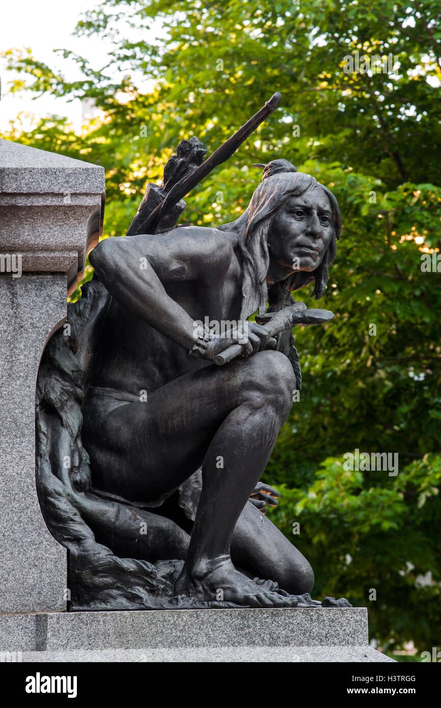 Iroquois, native American figure at the memorial of Paul Chomedey de Maisonneuve, founder of the old Montreal, Place d'Armes Stock Photo