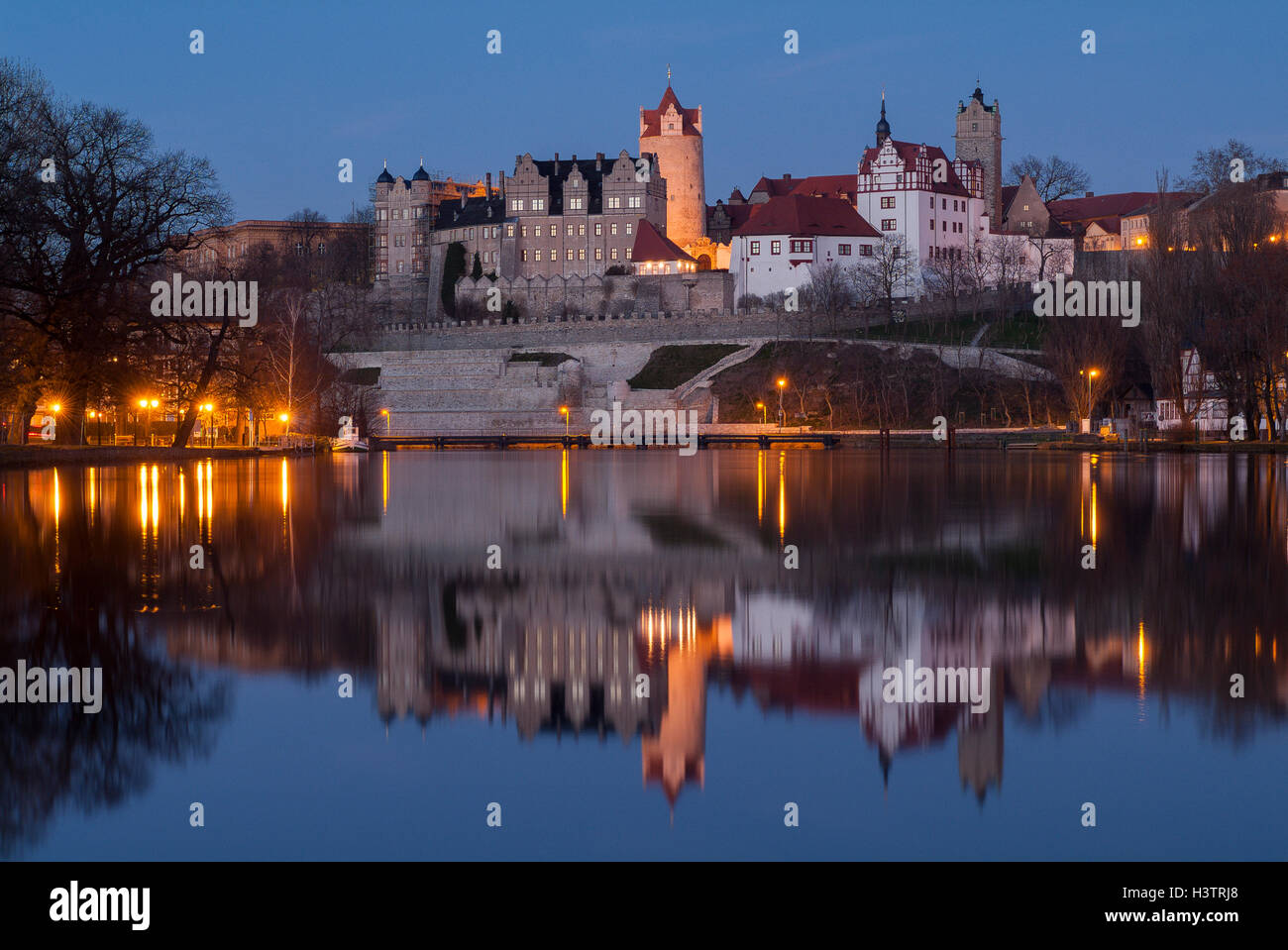 Schloss Bernburg by the river Saale, night scene, Bernburg, Saxony-Anhalt, Germany Stock Photo