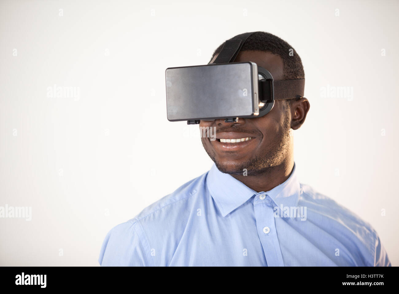 Man using virtual reality headset Stock Photo - Alamy