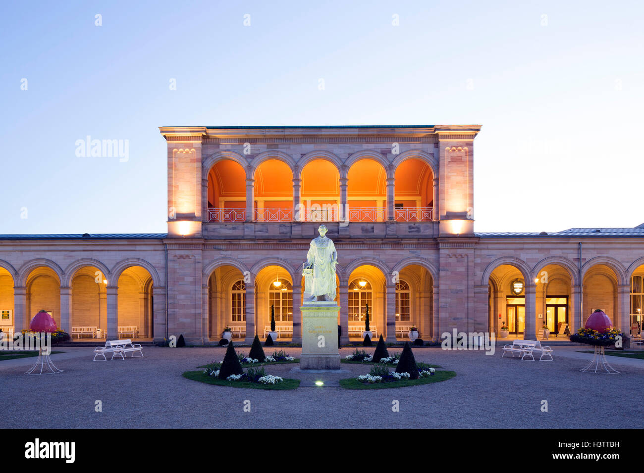 Lighted Arcade building at dusk, with Rossini-hall and arcade passage, Monument Ludwig I., spa garden Stock Photo