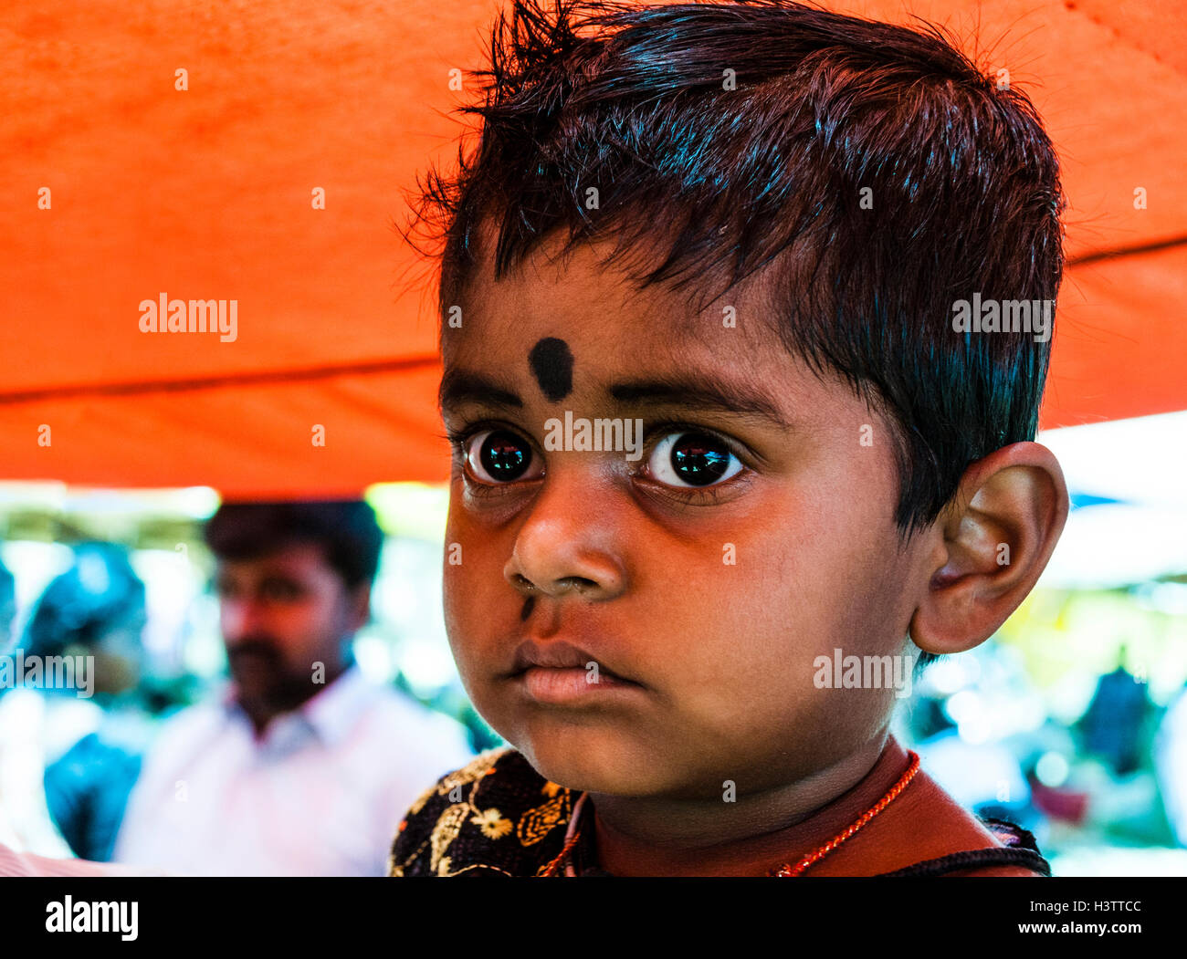 Little boy with big eyes, Chinnamanur, Tamil Nadu, India Stock Photo