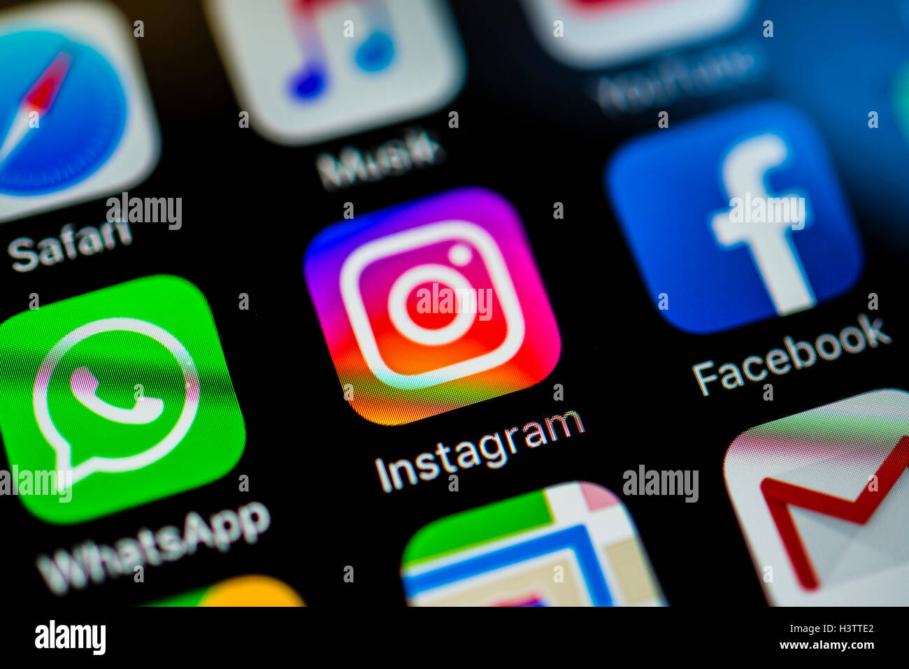 Smartphone screen with WhatsApp, Instagram and Facebook app icons in detail Stock Photo