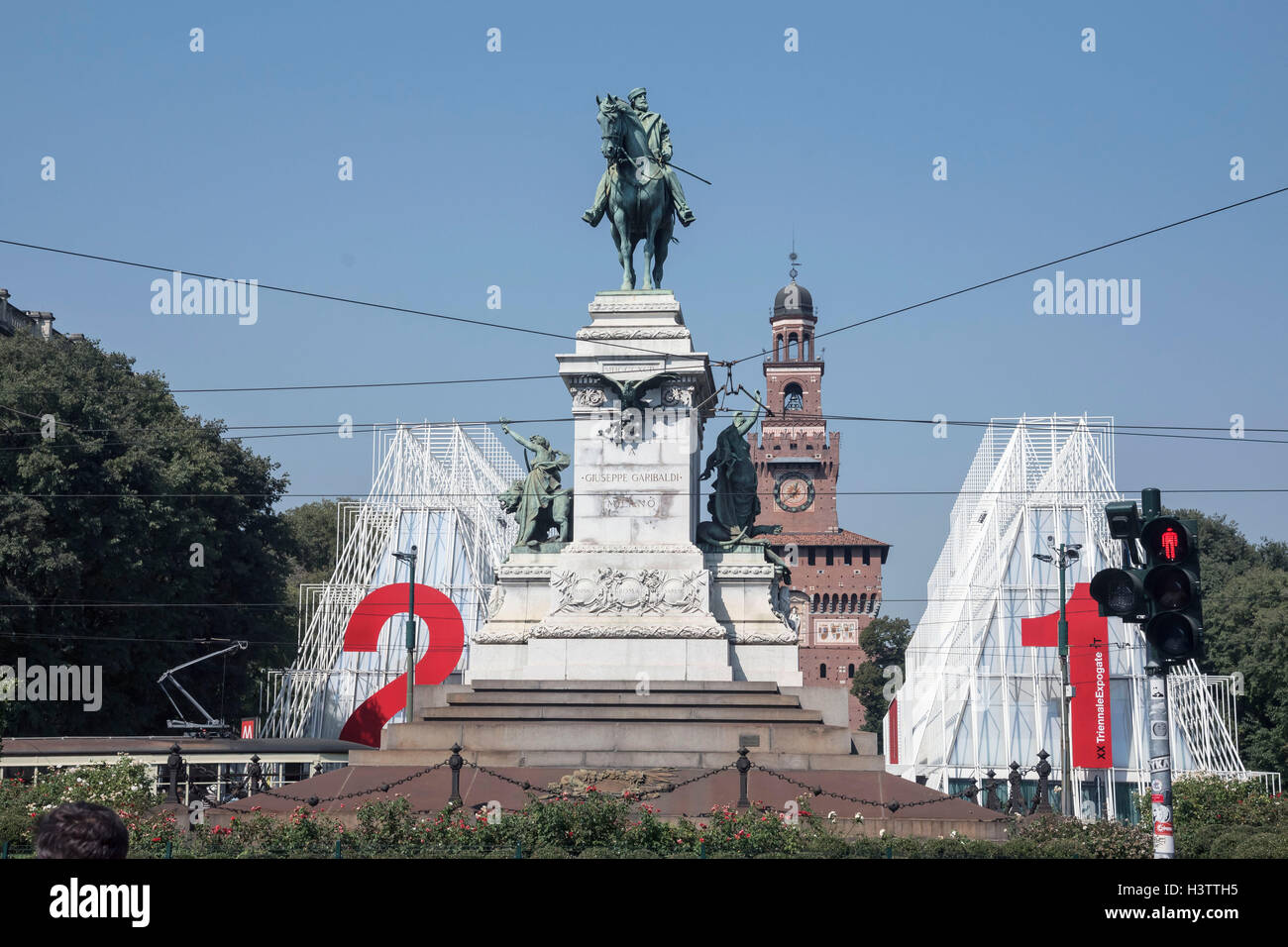 Imposing equestrian statue of Giuseppe Garibaldi  with Torre del Filarete  tower of Sforza Castle, Milan, Italy, Europe Stock Photo