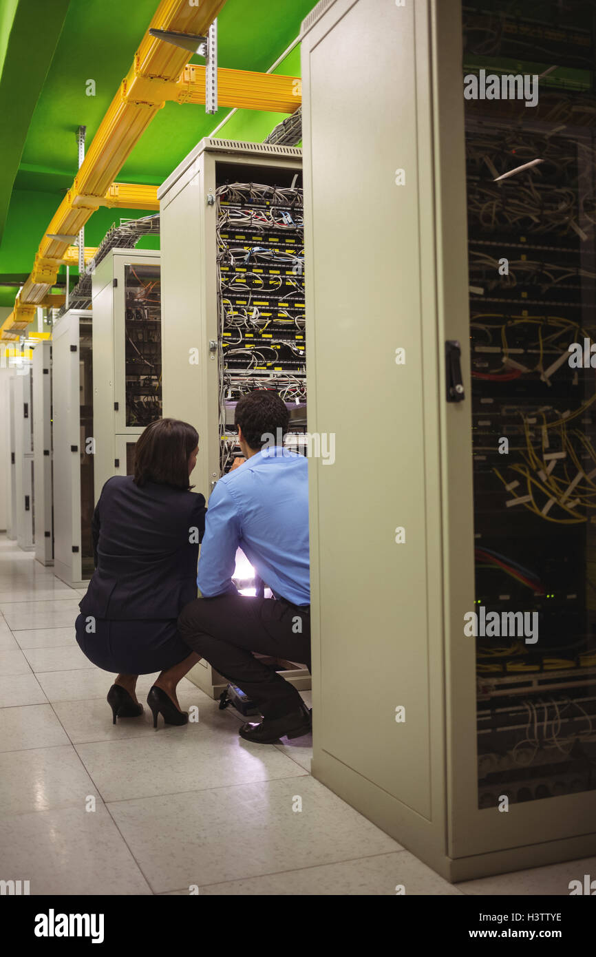 Technicians analyzing server Stock Photo - Alamy