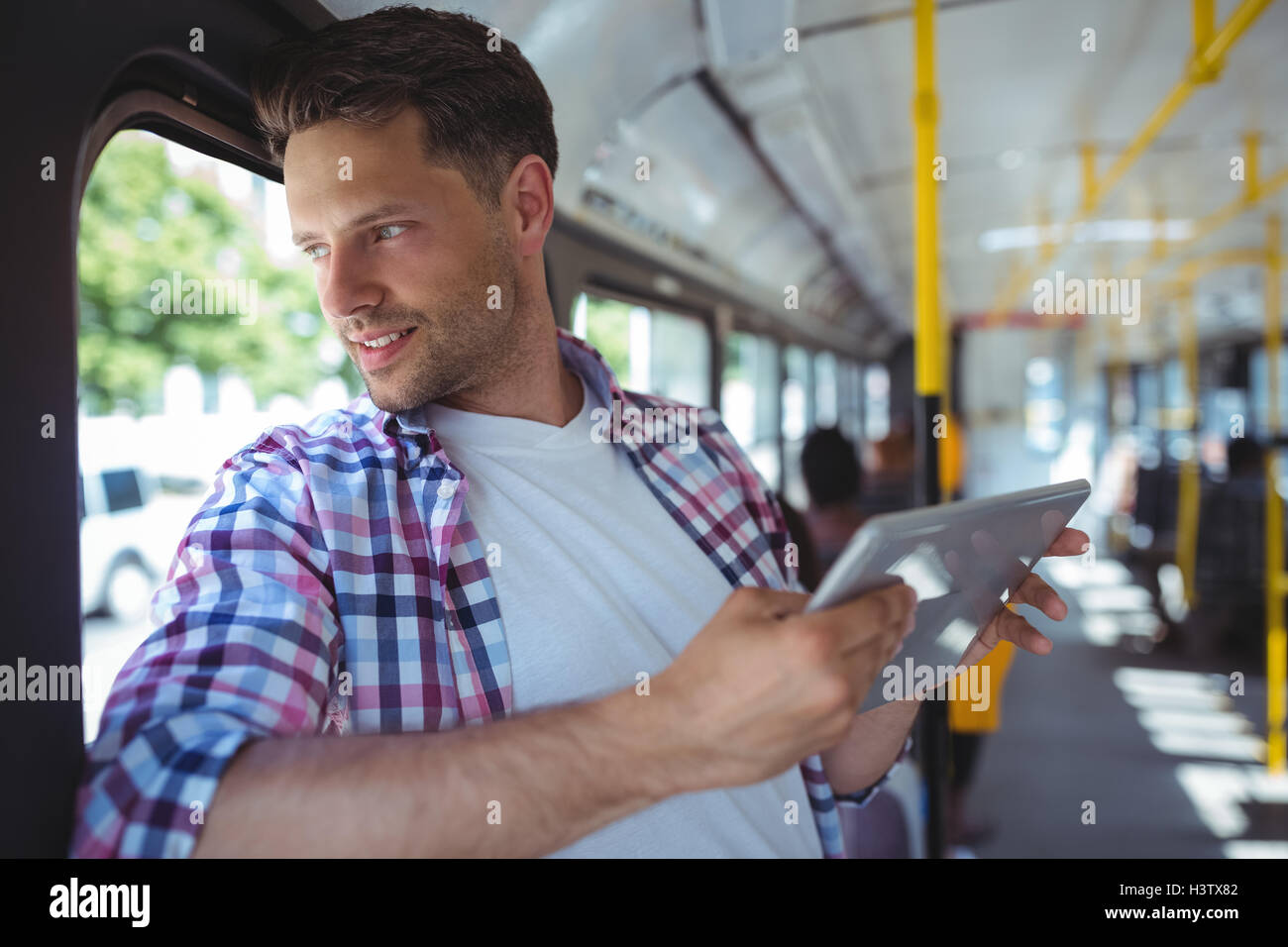 Handsome man using digital tablet Stock Photo - Alamy