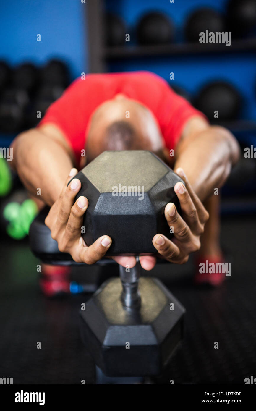 Athlete Exercising With Dumbbell On Bench Stock Photo 122864162