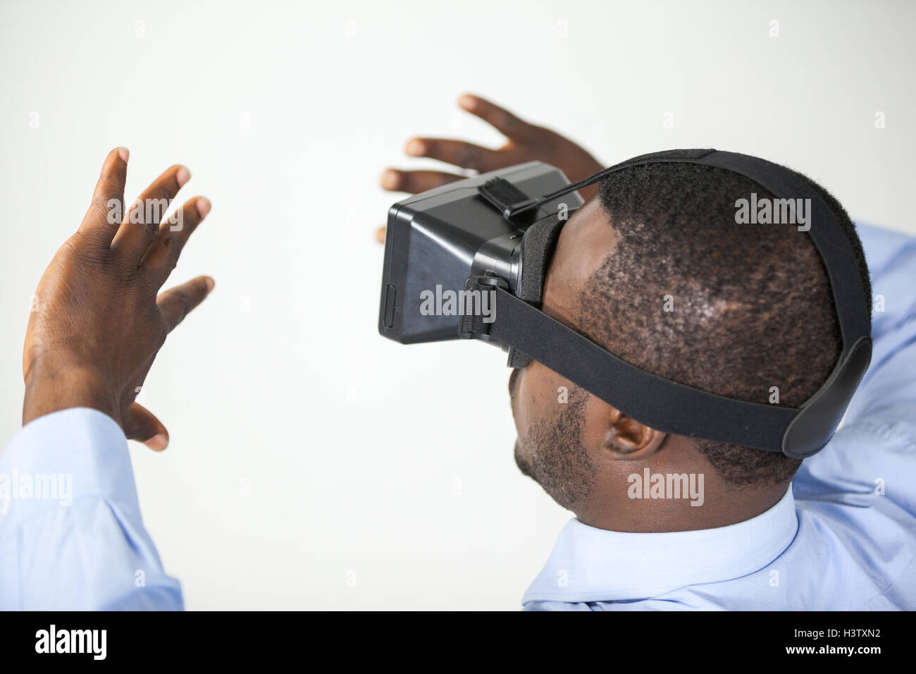 Man using virtual reality headset Stock Photo - Alamy