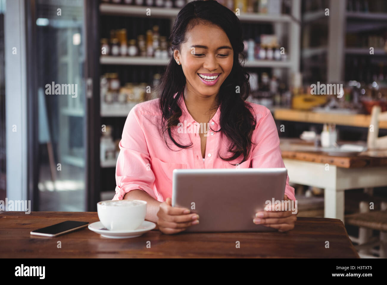 Beautiful woman holding digital tablet Stock Photo - Alamy