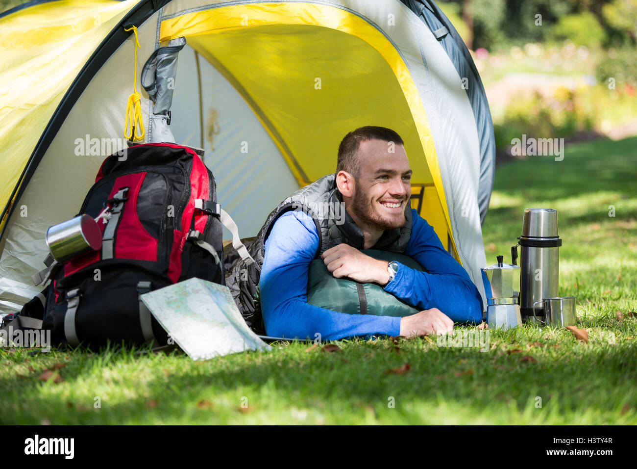 Smiling hiker lying in tent Stock Photo - Alamy