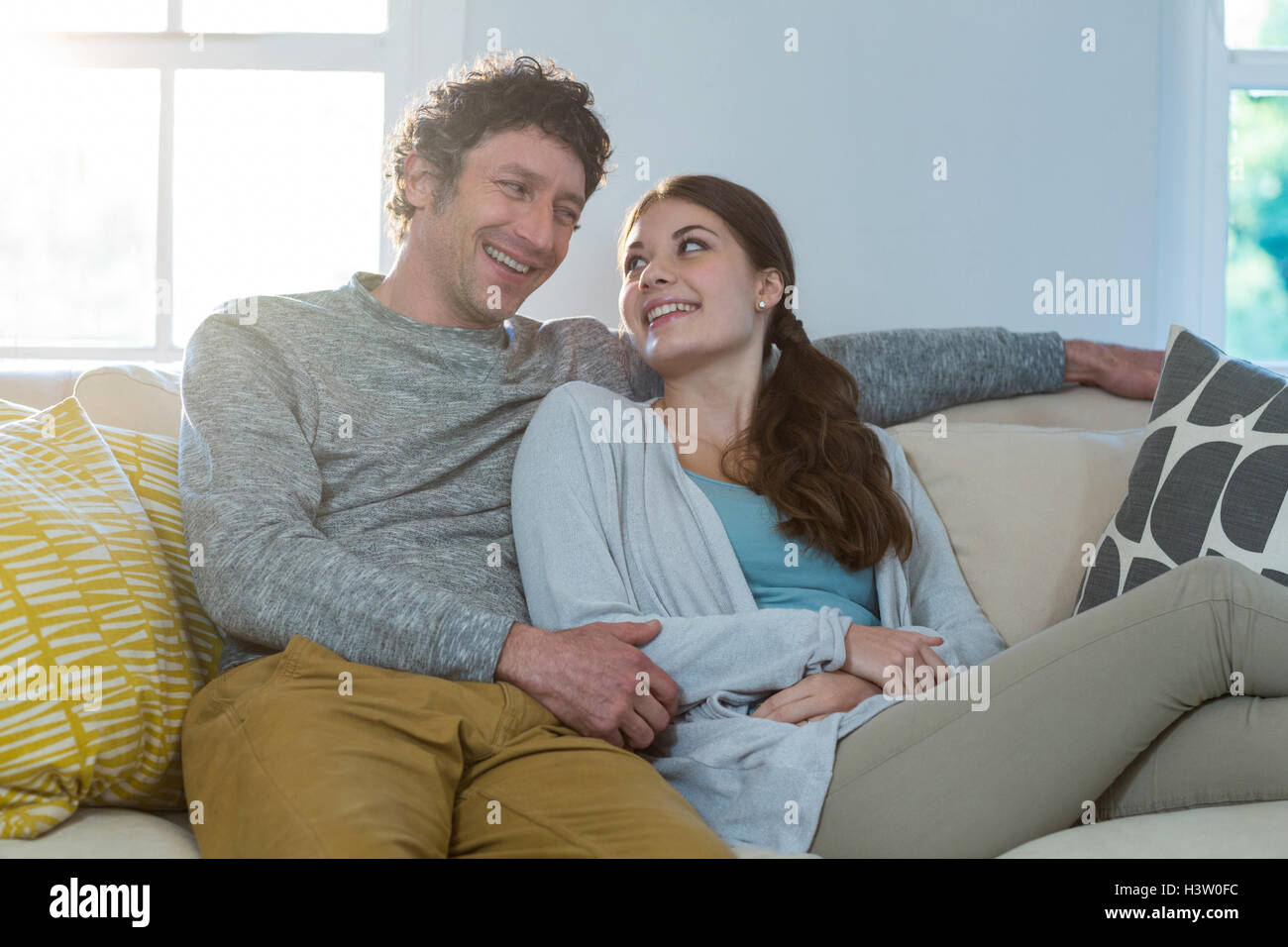 Sitting couple on sofa hi-res stock photography and images - Alamy