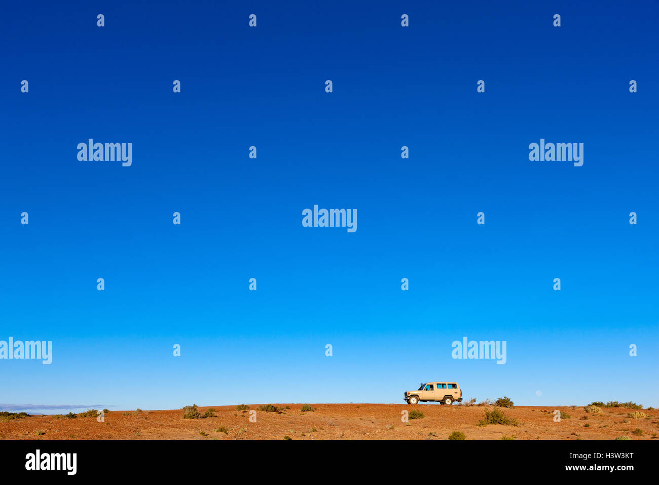 4WD vehicle in vast outback landscape, near Lake Eyre, South Australia. Stock Photo