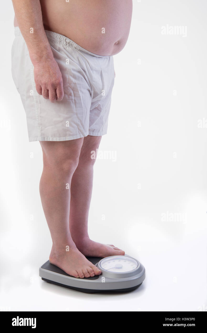Professional weight scale and Obese male Stock Photo Alamy
