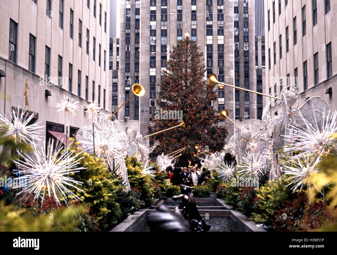GE building in the Rockefeller Centre at Christmas with angels browing trumpets in the foreground, New York, USA. Stock Photo