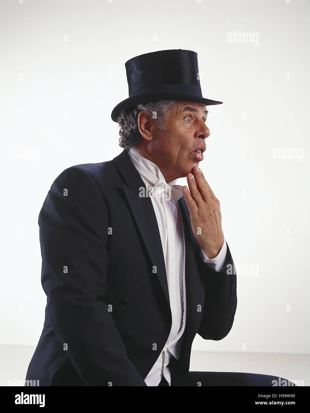 Man, tails, cylinder, amazes, gesture, half portrait, side view, senior, suit, headgear, top hat, elegantly, festively, facial play, surprises, there are astonished, taken aback, astonishment, bewilderment, surprise, preview, studio, cut outs, Stock Photo