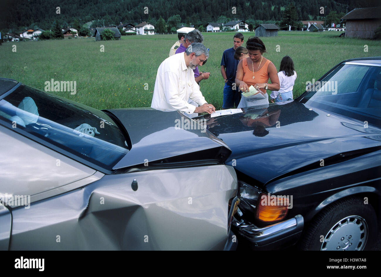 Street, traffic accident, damage to the bodywork, police, people involved, protocol family, driver, policeman, accident protocol, write, accident, street, car accident, personal details, clarification, accident cause, collision, damage to the bodywork Stock Photo