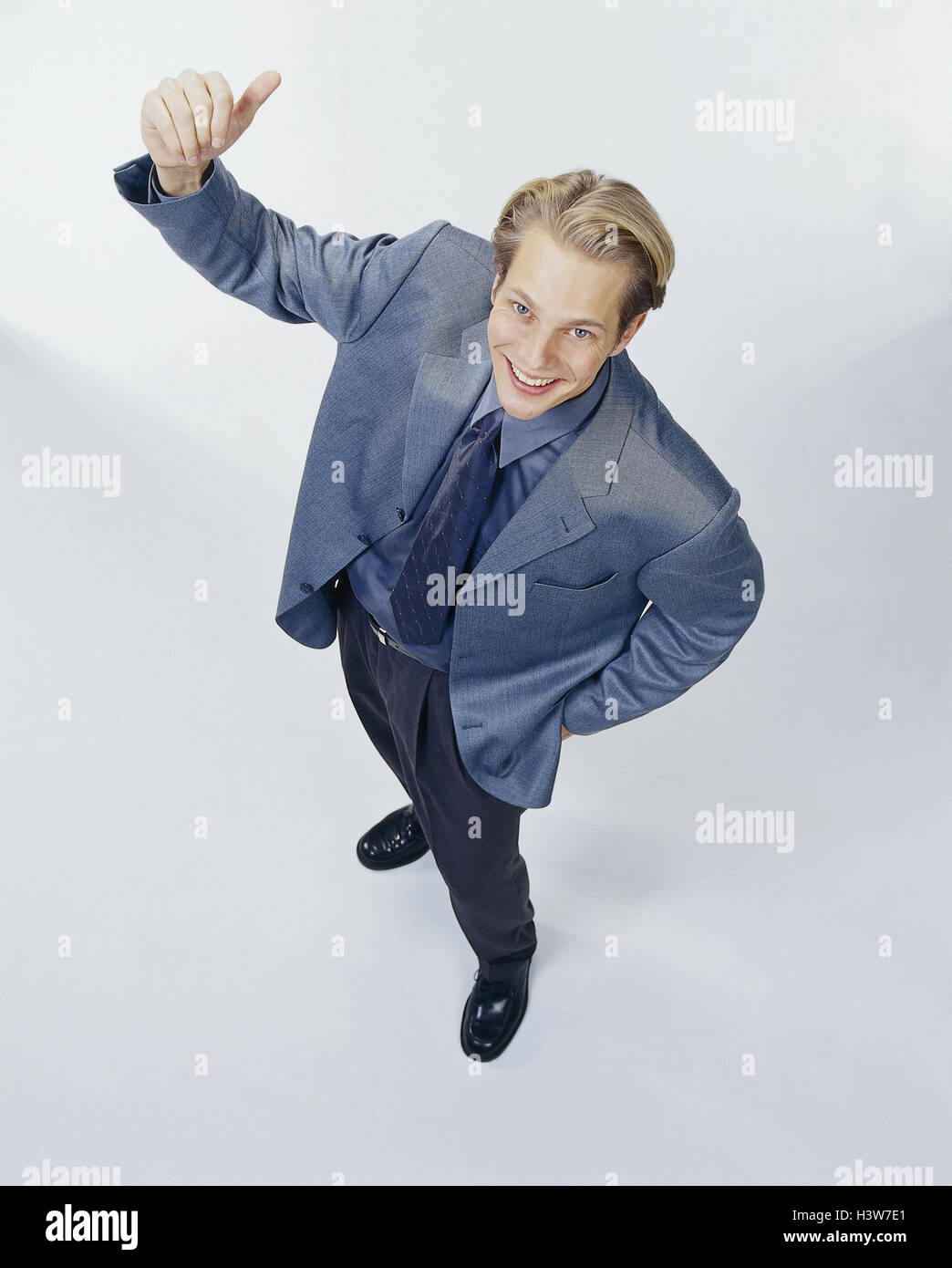 Man, laugh young, suit, gesture, pollex, high, Teens, young person, mood, printout, positively, O.K., joy, cheering, success, profit, victory, body language, stand, studio, cut out, Stock Photo