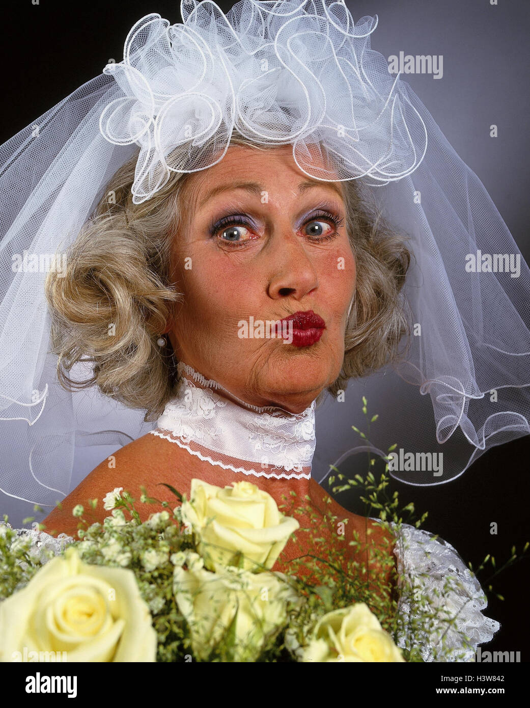 Bride, senior, wedding dress, veil, bridal bouquet, facial play, kiss,  portrait, Senior, studio, inside, woman, old, wedding, marry, Before,  marriage ceremony, marriage, marry, old person, luck, joy, kiss, kiss  mouth, near Stock