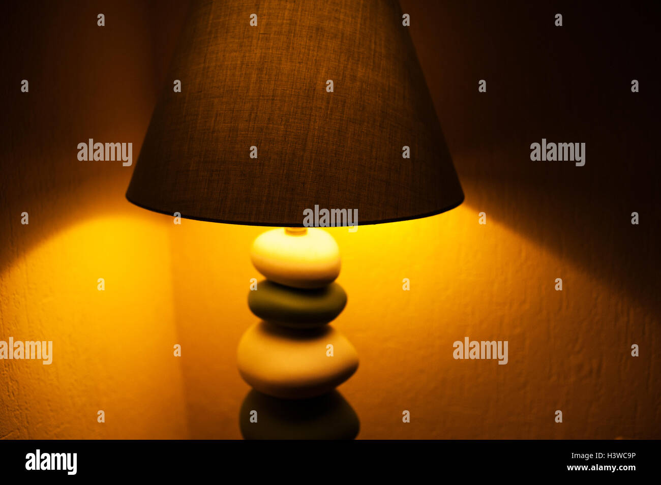included reading lamp by the bed in bedroom Stock Photo